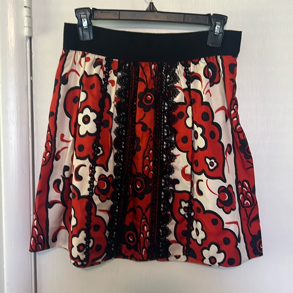 Cream, red, and black skirt. Mid-thigh, size 0